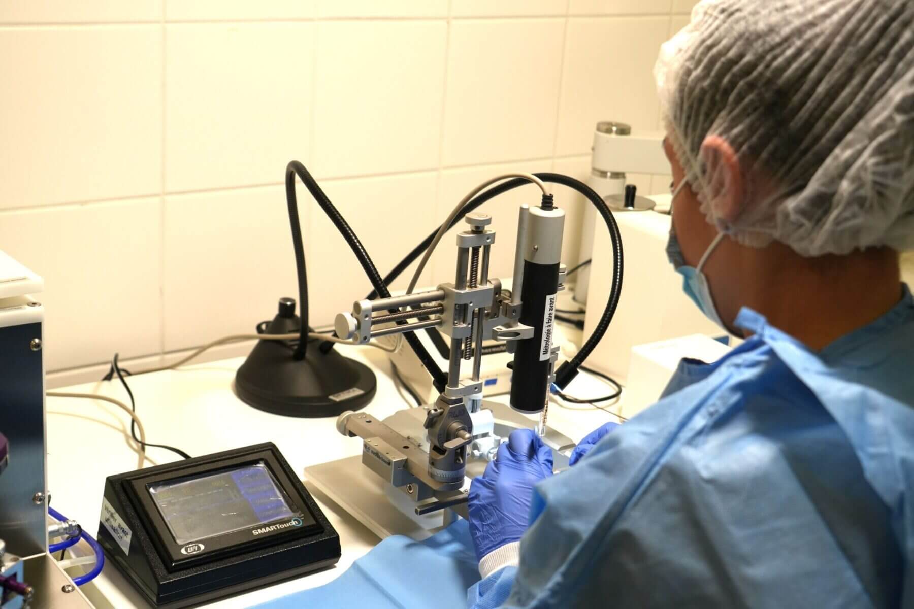 operator with stereotaxy and microsurgery station