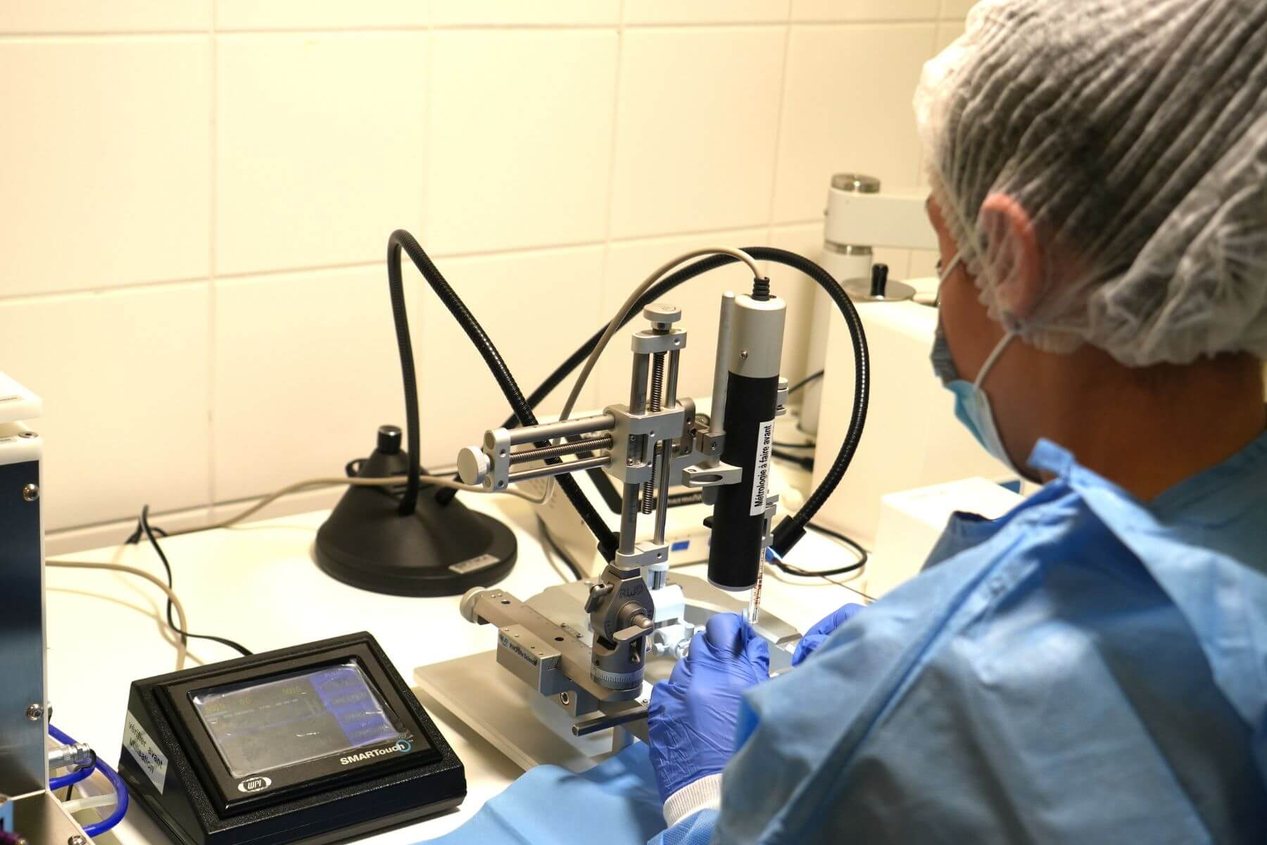 operator with stereotaxy and microsurgery station